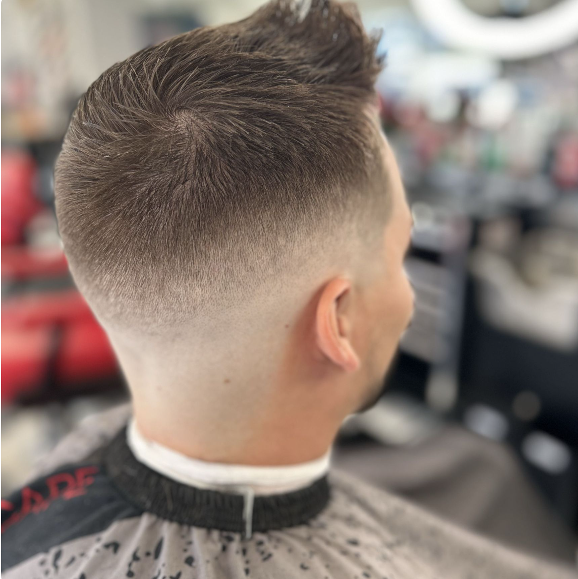 Clean skin fade with textured top
